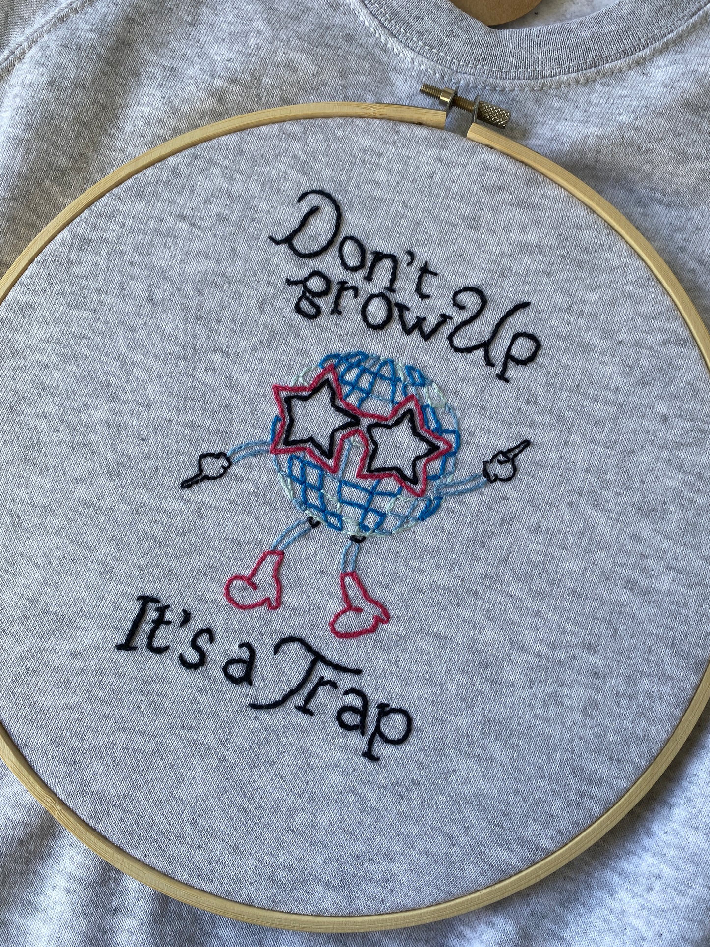 FELPA "DON'T GROW UP IT'S A TRAP"